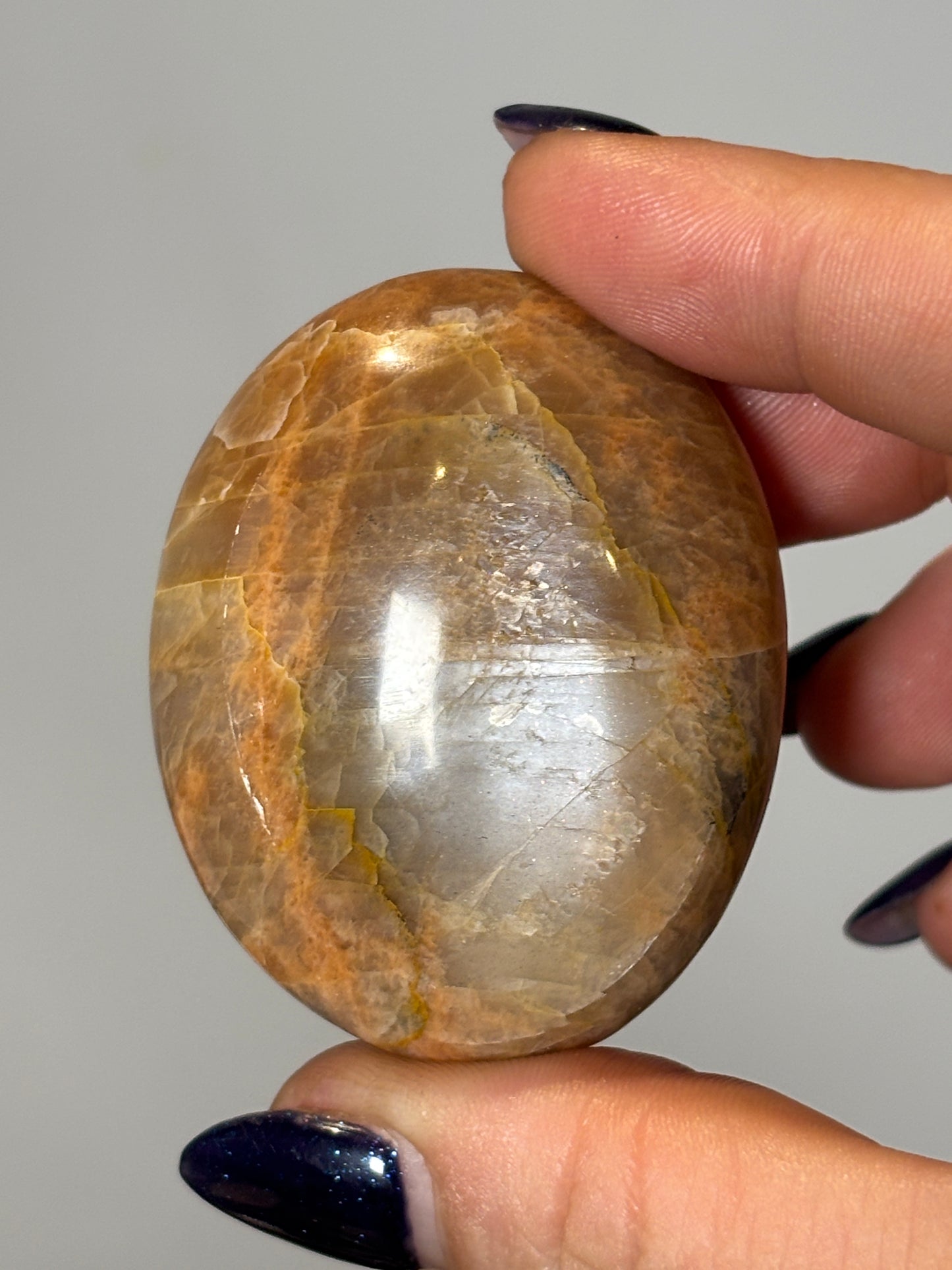 Peach moonstone palm stone