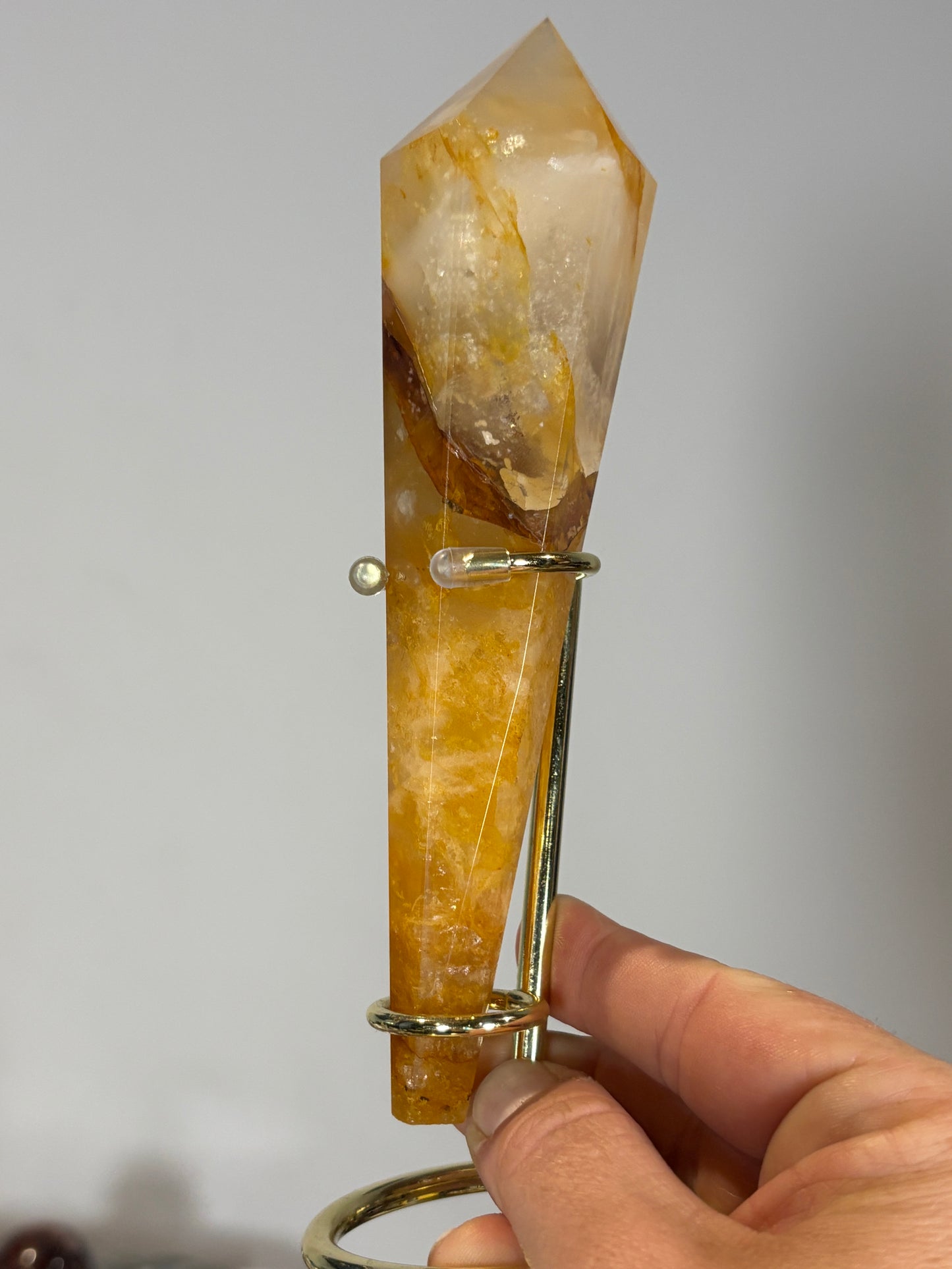Golden healer wand on gold metal stand