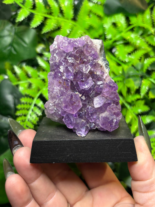 Amethyst cluster on wooden base - A