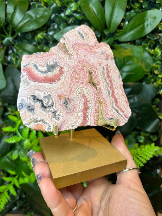 Rhodochrosite slab on stand
