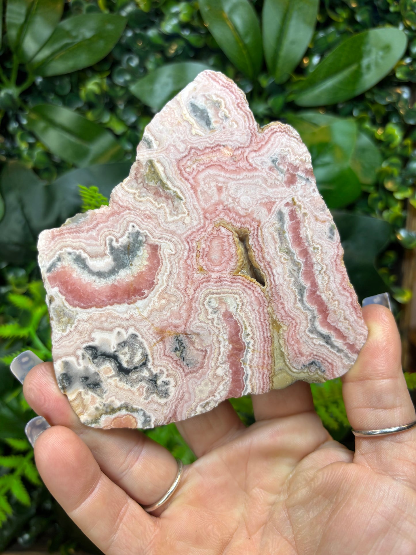 Rhodochrosite slab on stand