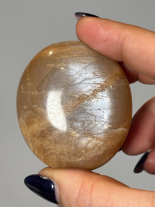 Peach moonstone palm stone