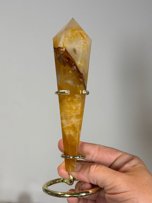 Golden healer wand on gold metal stand