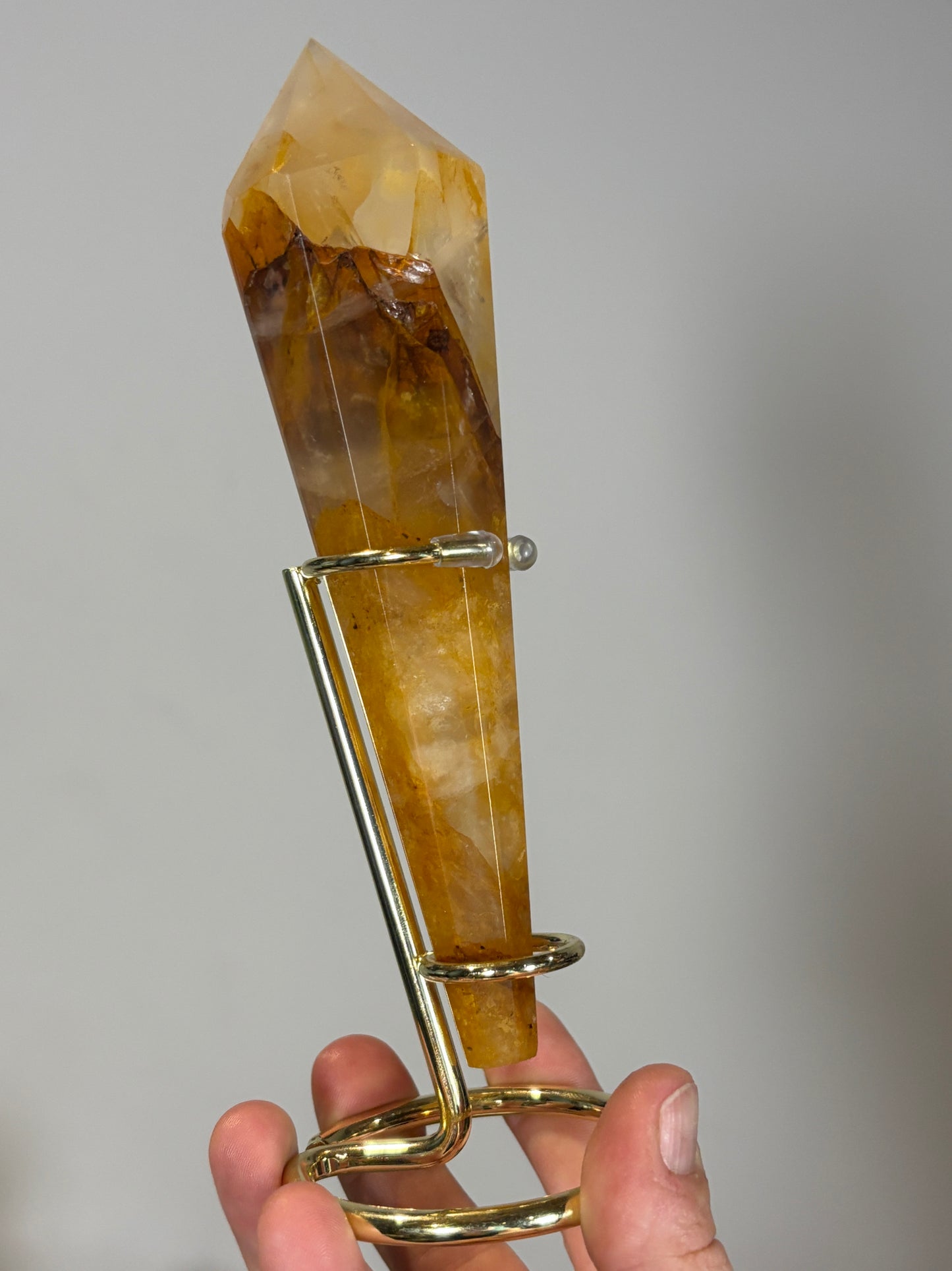 Golden healer wand on gold metal stand